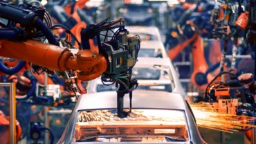 Robotic arms at work on a car production line