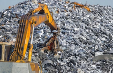 Stainless steel scrap is moved by a teleporter's claw