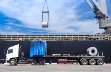 Steel coils being loaded from a cargo ship