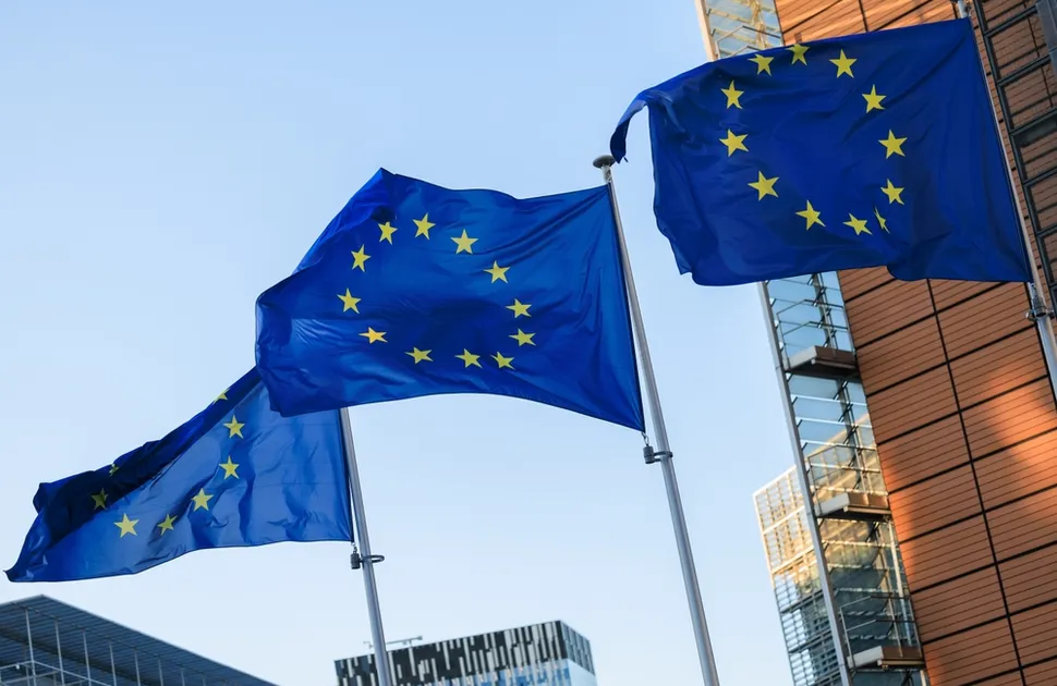 European flags in front of the Berlaymont building, headquarters of the European Commission