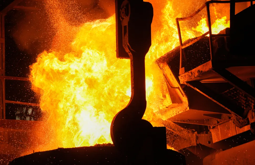Steel production in electric furnaces. Sparks of molten steel. Electric arc furnace shop EAF.